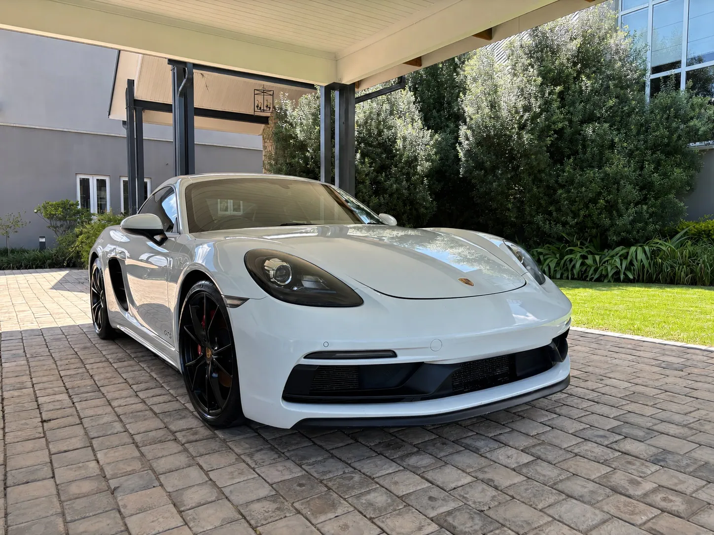 White Porsche with a glossy ceramic-coated finish