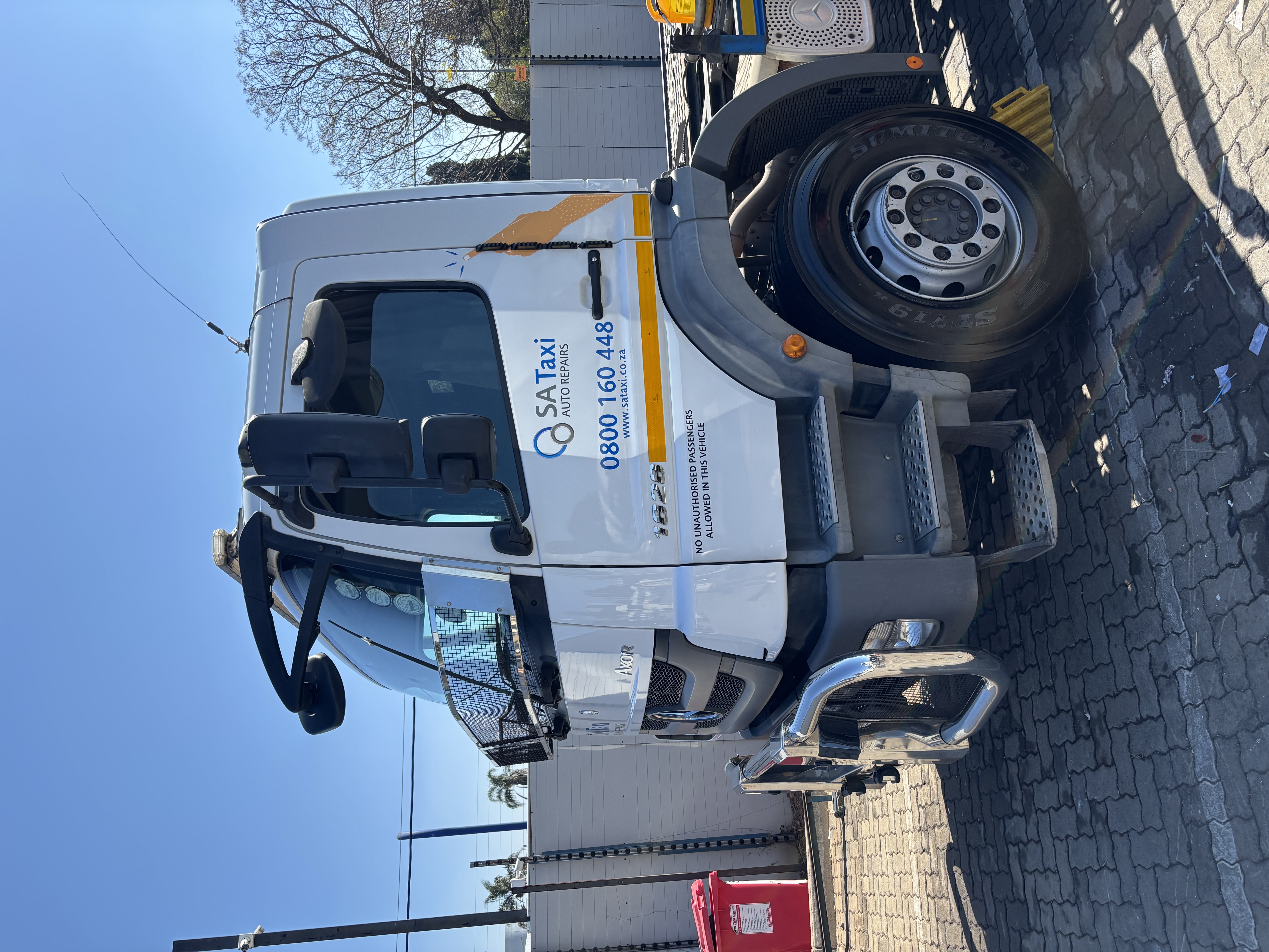 SA Taxi Axor cab, step and wheel area after truck detailing