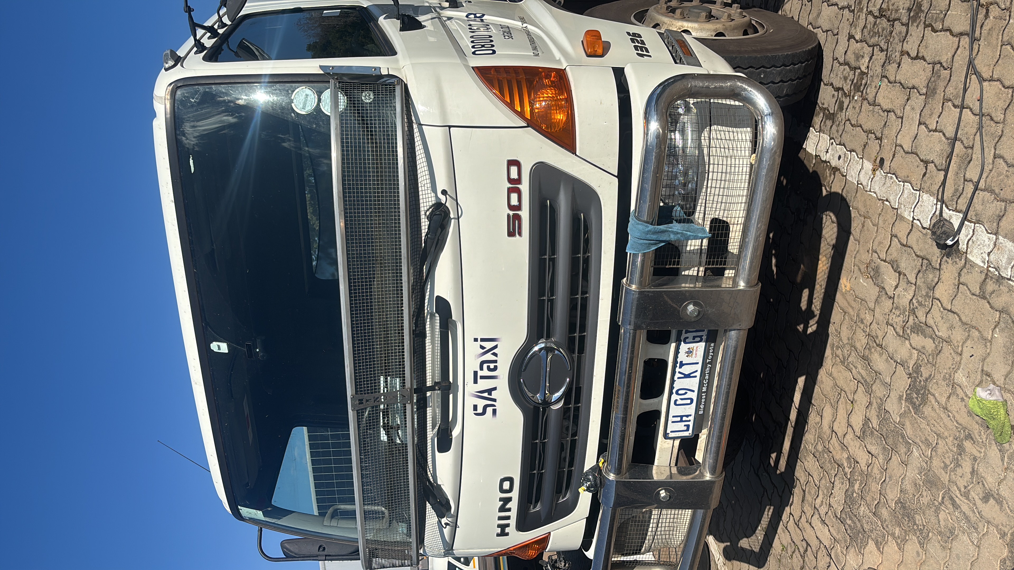 Before image of a dirty, unpolished SA Taxi Hino truck before detailing